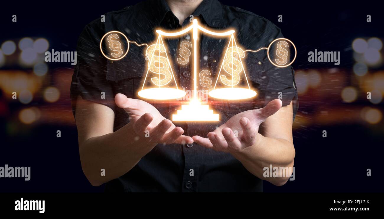 Man holding law paragraph and balance of justice. The icon of the balance of justice. Concept of