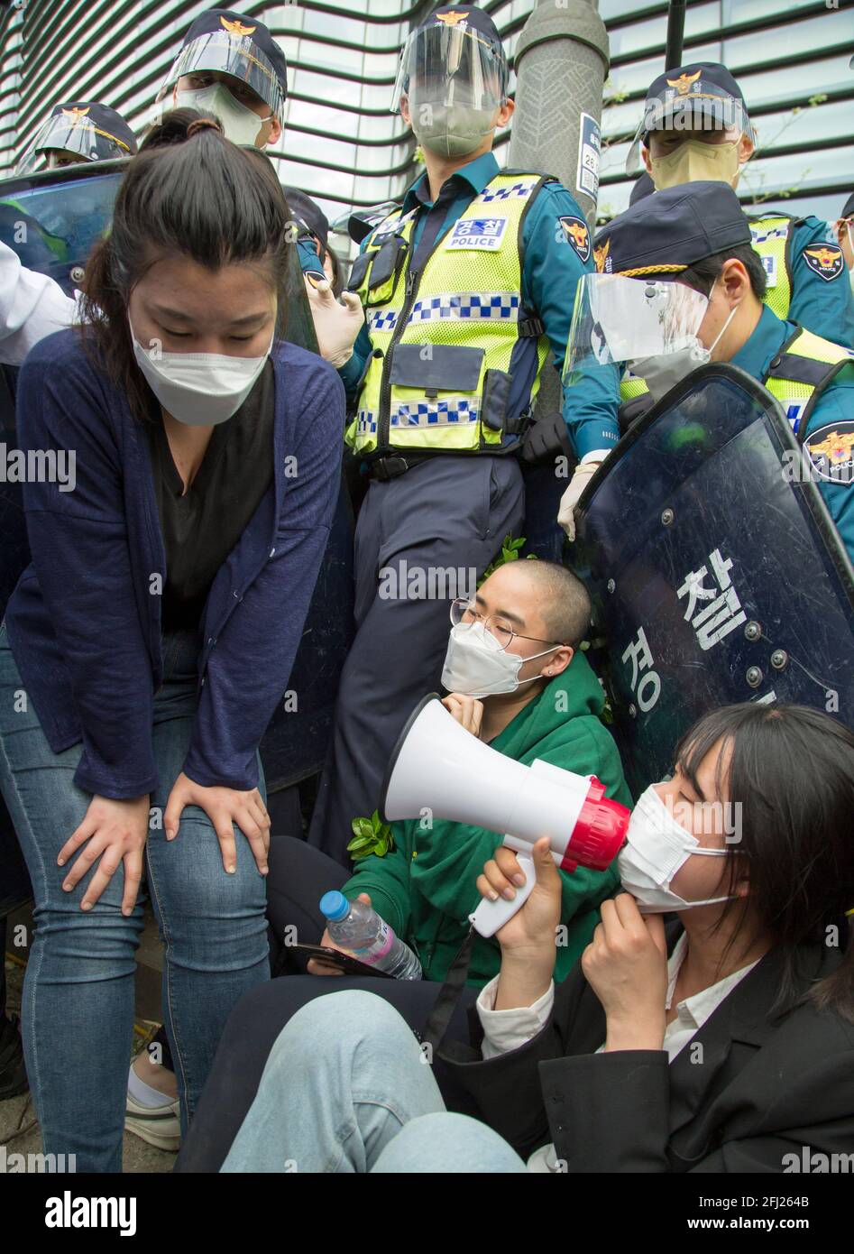 Seoul, South Korea. 24th Apr, 2021. Policemen block student protesters during a demo against the Japanese government in front of the Japanese Embassy in Seoul.Japan recently decided to start discharging the tritium-laced water from the destroyed Fukushima nuclear power plant into the Pacific Ocean in 2023 despite opposition from neighboring countries including South Korea. Credit: SOPA Images Limited/Alamy Live News Stock Photo