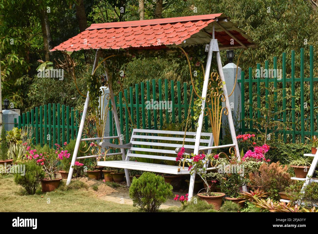 Garden Family swing with red roof Stock Photo