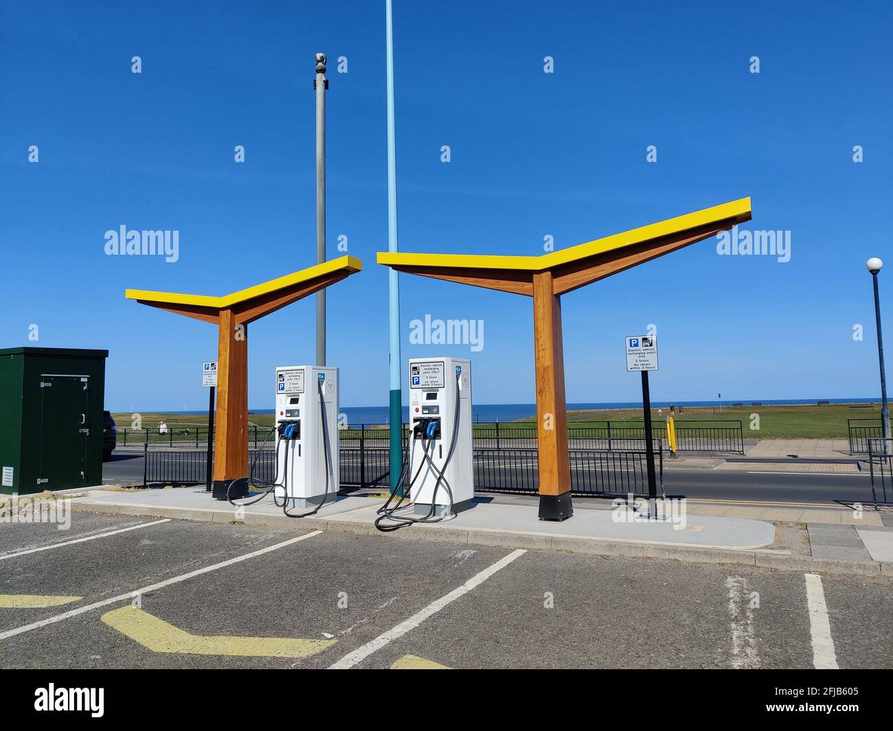 electric car public charging station in car park in England Stock Photo