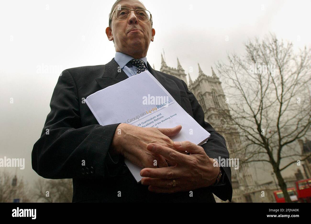 MIKE TOMLINSON,CHAIRMAN OF THE WORKING GROUP 14-19 REFORM.OUTSIDE THE QE2,WITH HIS REPORT.17/2/04 PILSTON Stock Photo