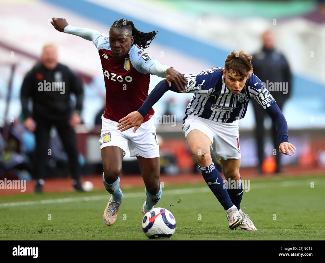 Aston Villa's Bertrand Traore (left) and West Bromwich Albion's Conor Townsend battle for the ball during the Premier League match at Villa Park, Birmingham. Picture date: Sunday April 25, 2021. Stock Photo