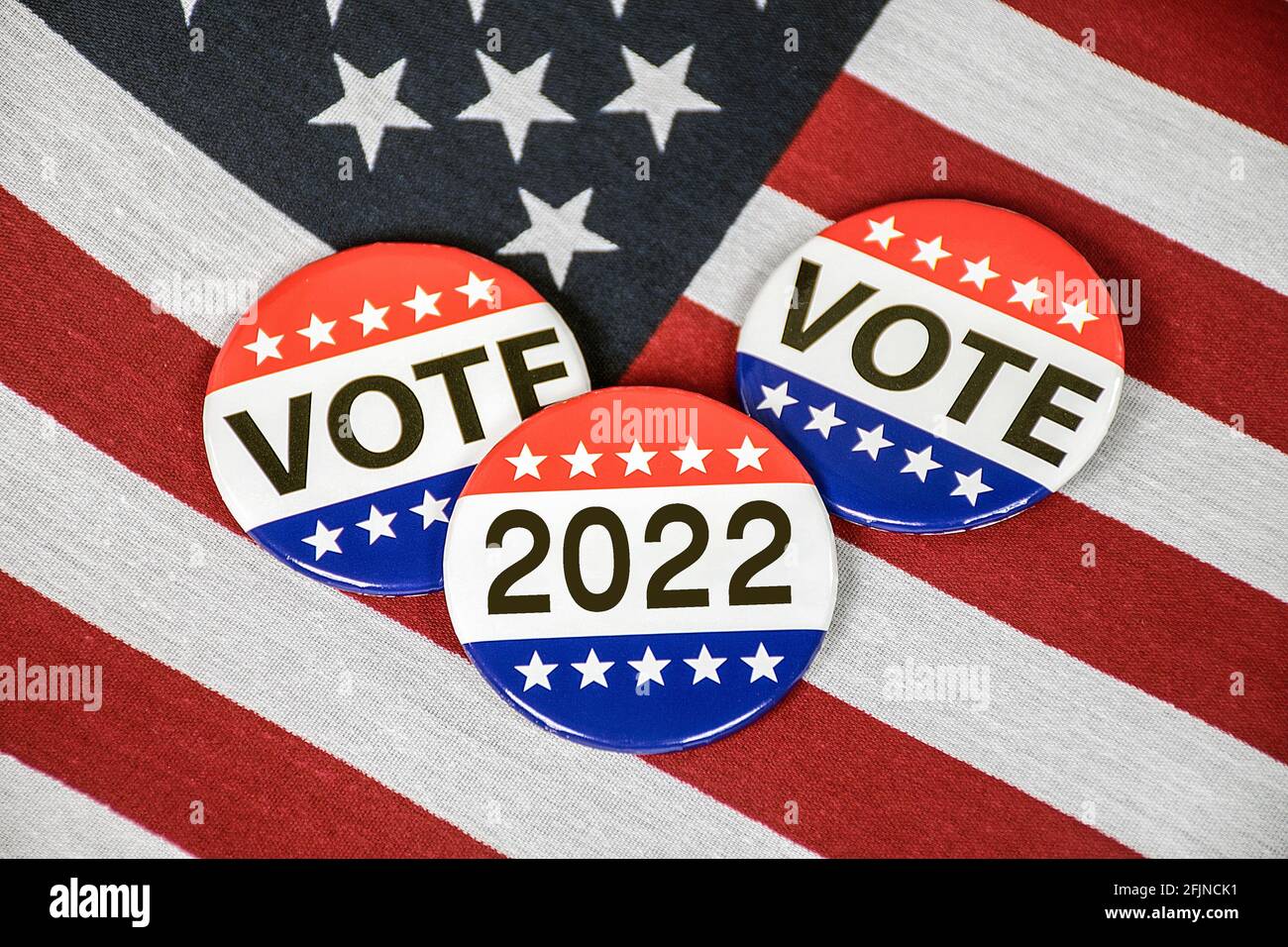 Election campaign vote buttons on American flag for 2022 Stock Photo