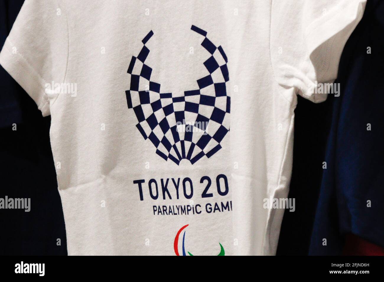 Tokyo, Japan. 25th Apr, 2021. A T-shirt with a symbol of Tokyo Olympic and  Paralympic Games 2020 sold at the official shops. Japan Olympics minister  Seiko Hashimoto commits to games as infections