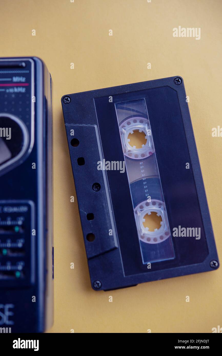 Still life of an audio cassette next to a 1980s Walkman Stock Photo - Alamy