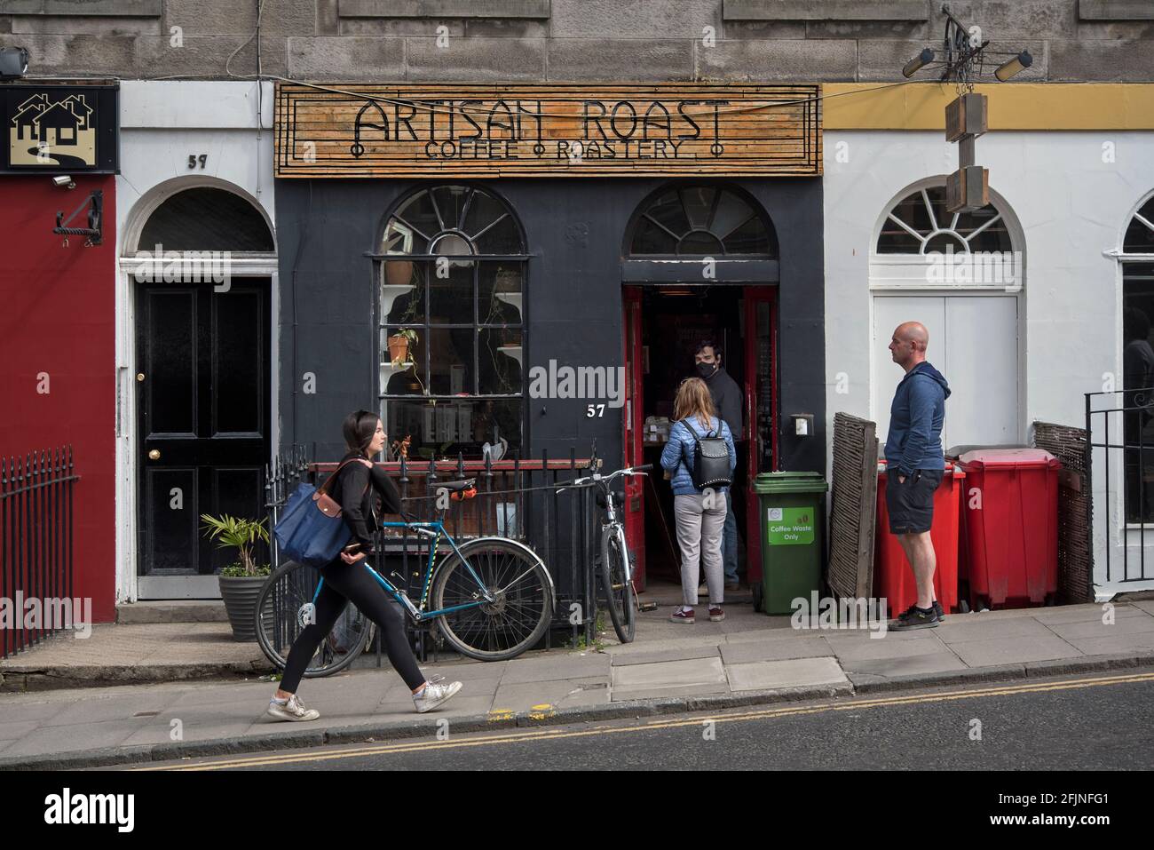 Customers queueing outside Artisan Coffee, Broughton Street, Edinburgh, Scotland during the covid-19 pandemic. Stock Photo