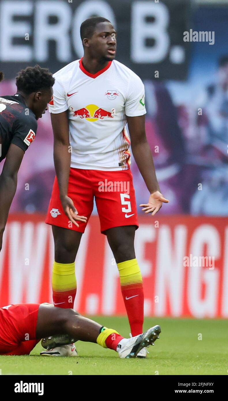 25 April 2021, Saxony, Leipzig: Football: Bundesliga, Matchday 31, RB  Leipzig - VfB Stuttgart at Red Bull Arena Leipzig. Leipzig's defender  Ibrahima Konate (M) stands with the wrong number on his pants