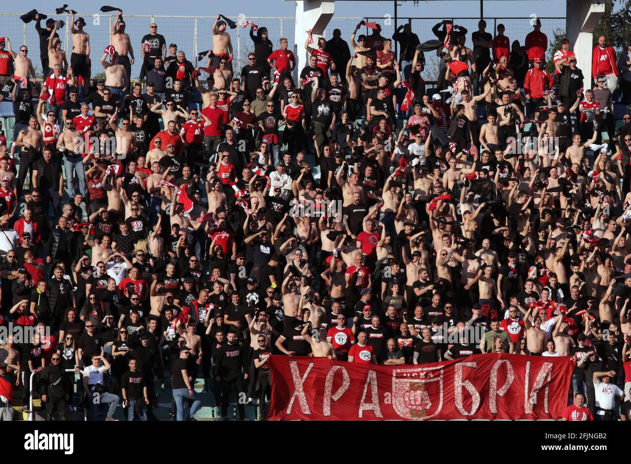 Sofia, Bulgaria: 25 April, 2021: CSKA Sofia's supporters cheer their team during the national championship football match between Levski and CSKA Sofia. Football fans have been allowed to attend the stadium with less than 30% of the seats amidst the coronavirus pandemic. Credit: Pluto/Alamy Live News Stock Photo