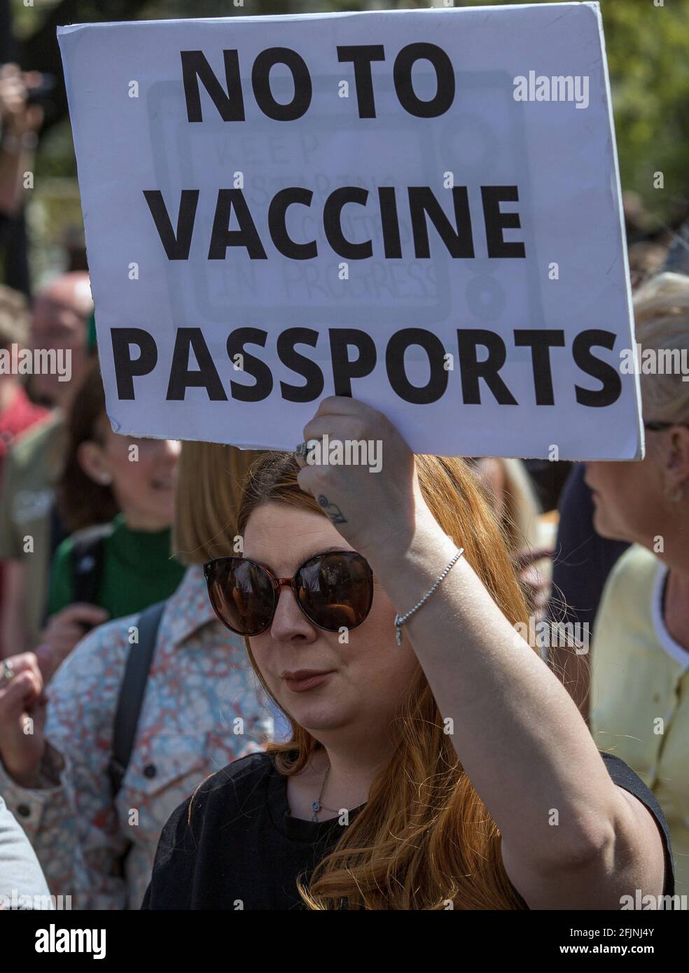 April 24, 2021, London, England, United Kingdom:  A woman holds a sign “No To Vaccine Passports.” during an anti-lockdown 'Unite for Freedom' protest Stock Photo