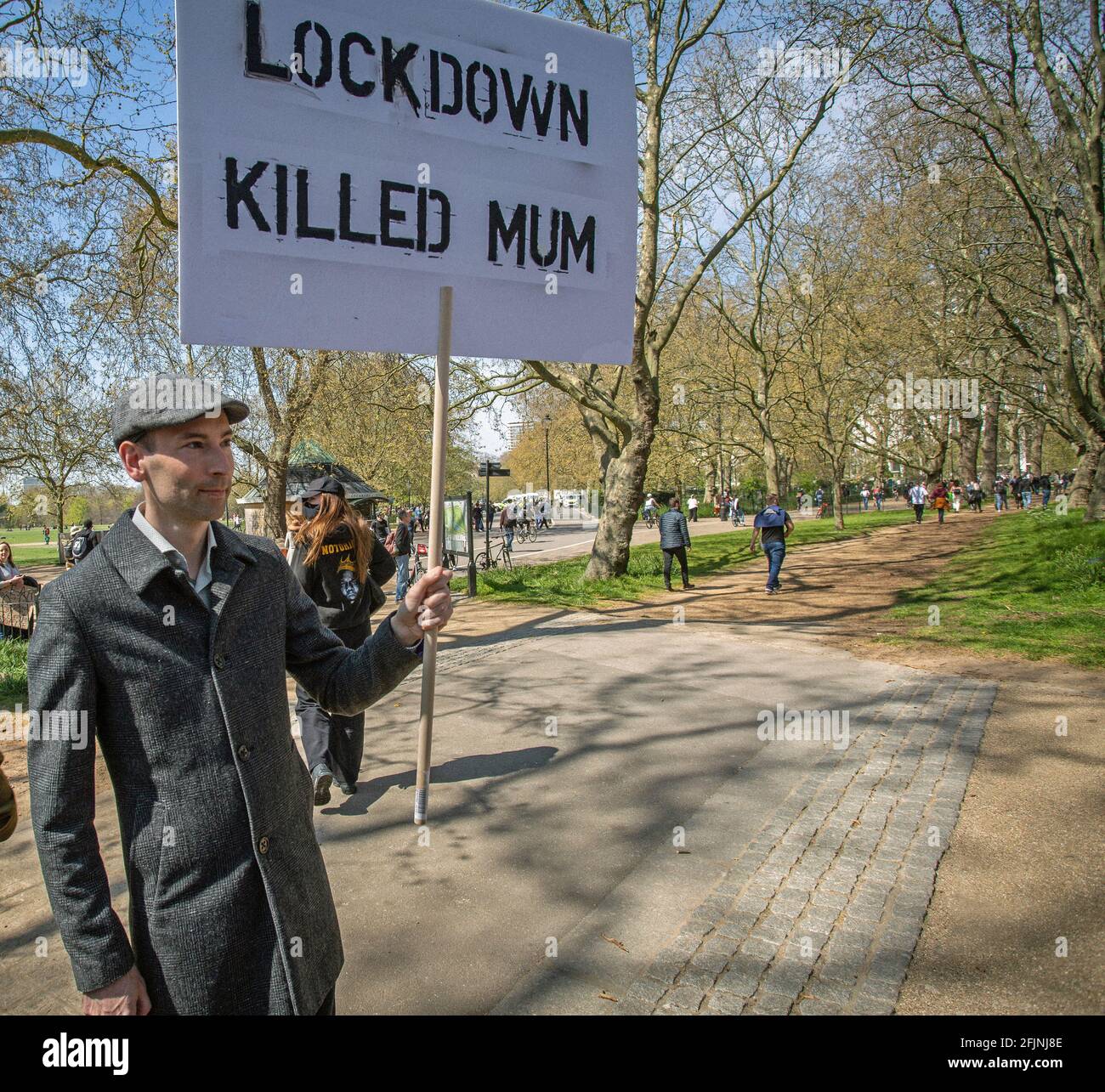 April 24, 2021,London, England, United Kingdom:   Man holds a sign “Lockdown killed Mum “during an anti-lockdown 'Unite for Freedom' protest in London Stock Photo