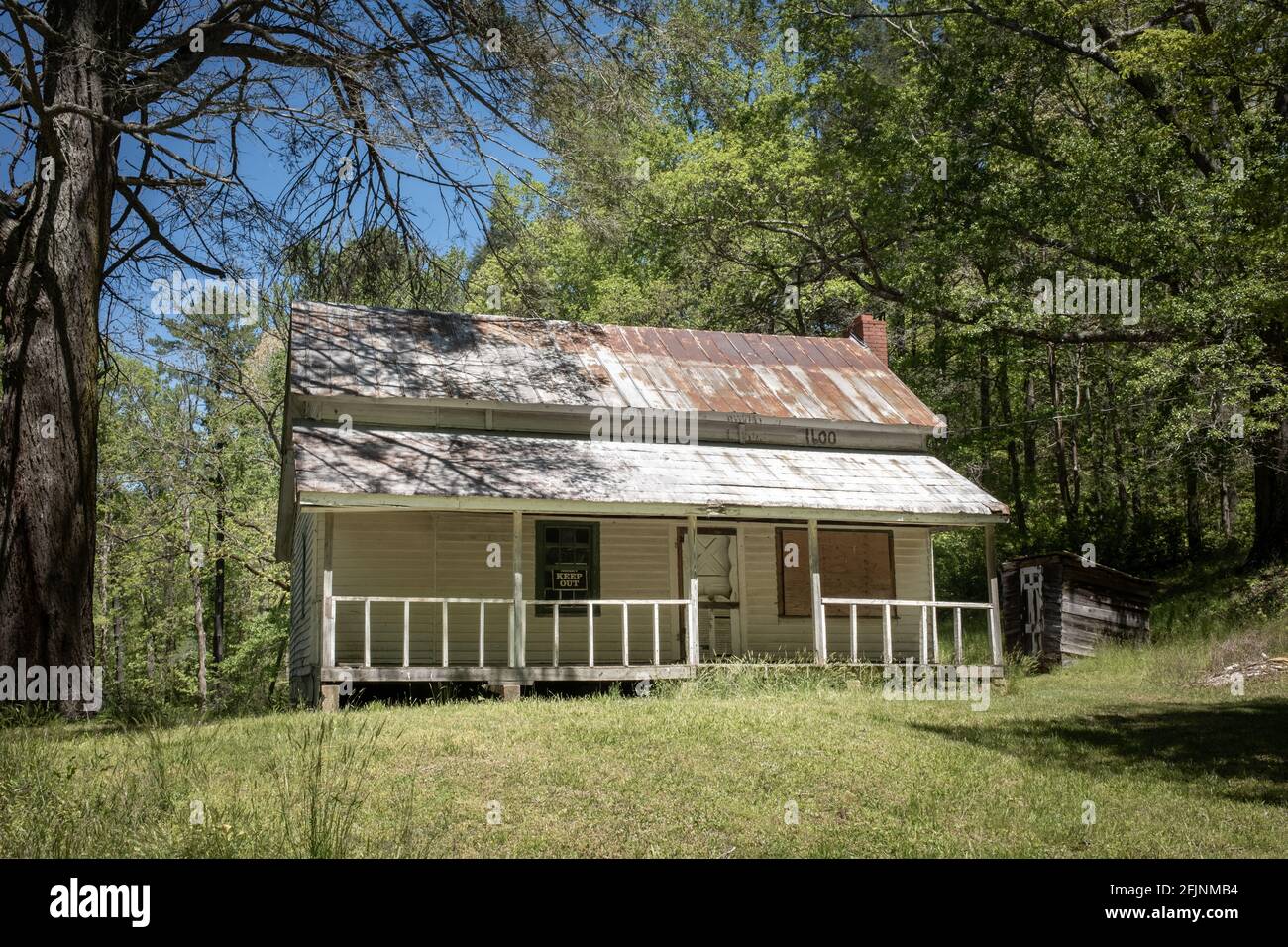 An abandoned farmhouse and barn remain stunning in its countryside