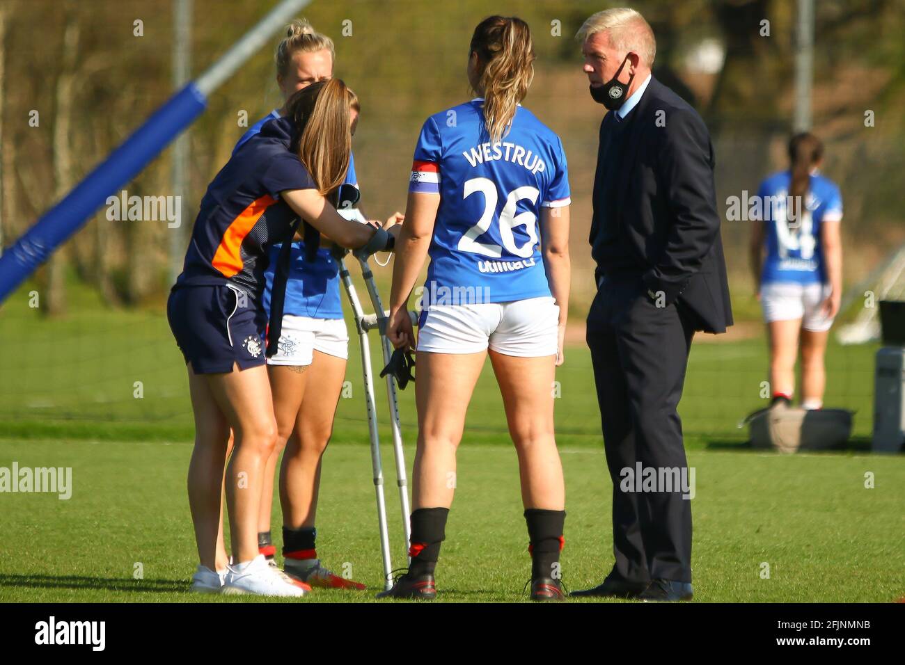 Milngavie, East Dunbartonshire, Scotland. 25th April, 2021. Kirsty Howart (#21) of Rangers Women FC visits here team mates on crutches following her ACL Injury after the Scottish Building Society Scottish Women's Premier League 1 Fixture Rangers FC vs Forfar Farmington FC, Rangers Training Complex, Milngavie, East Dunbartonshire. 25/04/2021 | Credit Colin Poultney/Alamy Live News Stock Photo
