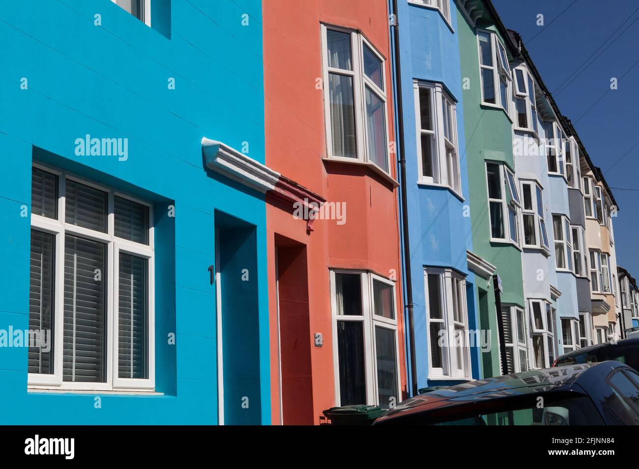 A terrace of brightly painted houses in Brighton, UK Stock Photo