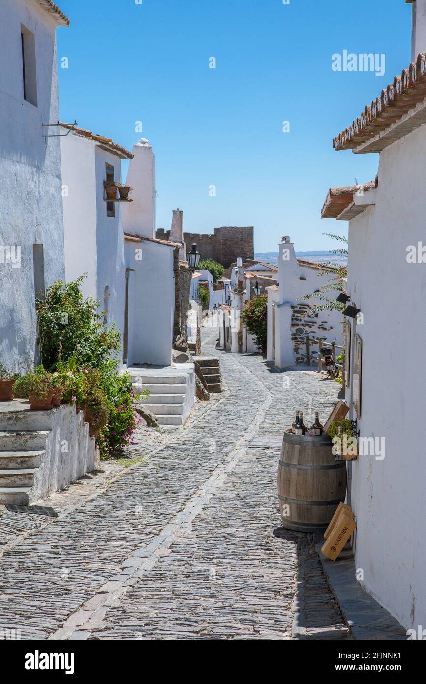 Whitewashed traditional houses in the medieval hilltop village of Monsaraz in the region of Alentejo, Portugal. Stock Photo