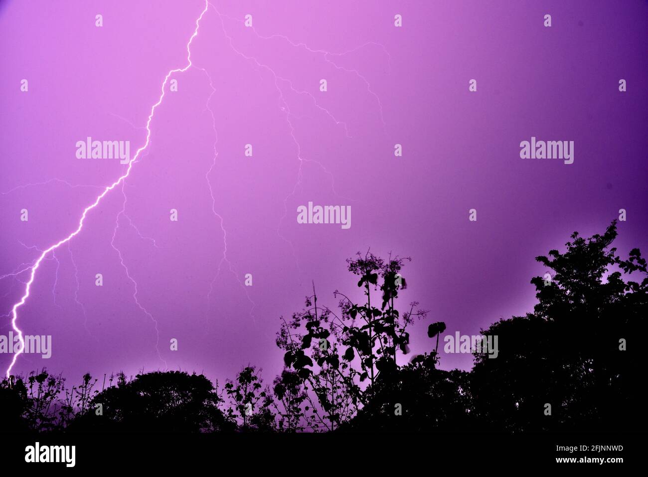 Lightning during a thunder storm in Thailand Stock Photo