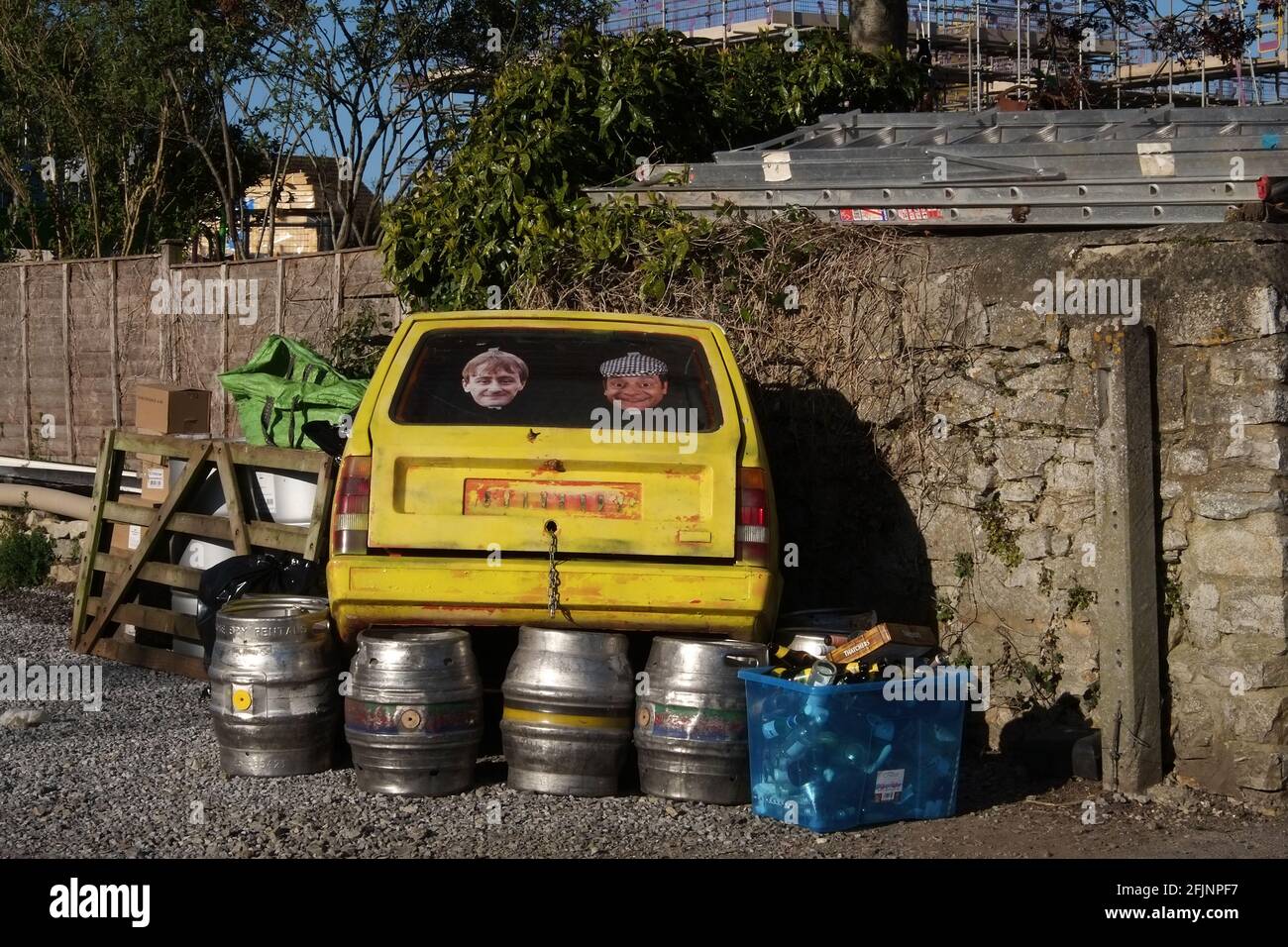 April 2021 - Only fools & horses three wheeler van crashed into a pub wall, used as advertising Stock Photo