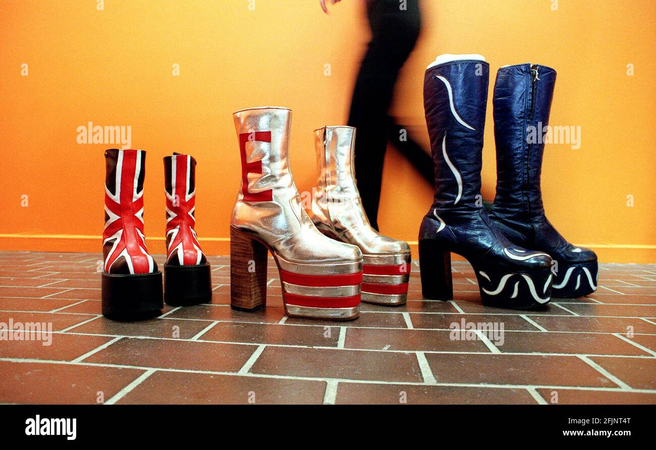 EXHIBITION OF ROCK AND ROLL COSTUMES AT THE BARBICAN.L-R: BOOTS WORN BY GERRI HALLIWELL; BOOTS WORN BY ELTON JOHN IN TOMMY; BOOTS WORN BY GEORGE CLINTON. Stock Photo
