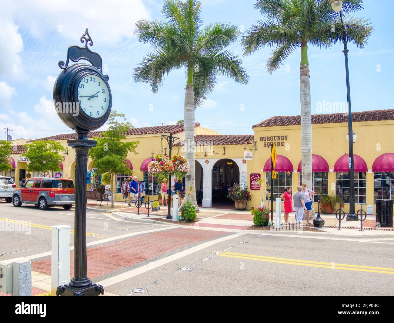 Tall clock on Miami Avenue shopping area in downtown Venice Florida USA Stock Photo