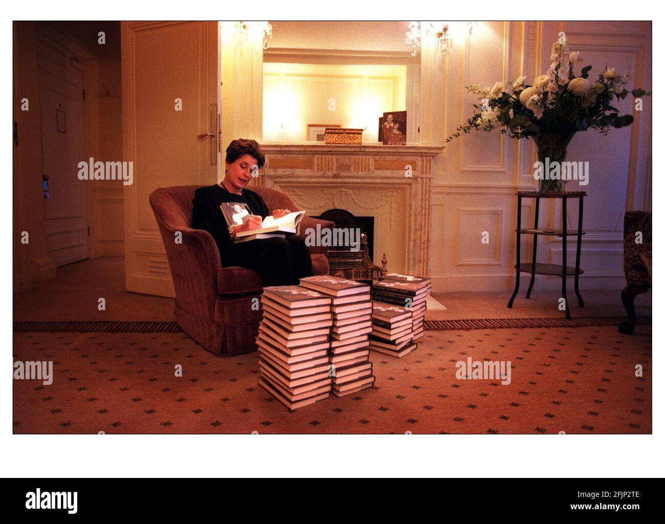 Tina Sinatra singing copies of her book in the Savoy hotel Oct 2000 Stock Photo