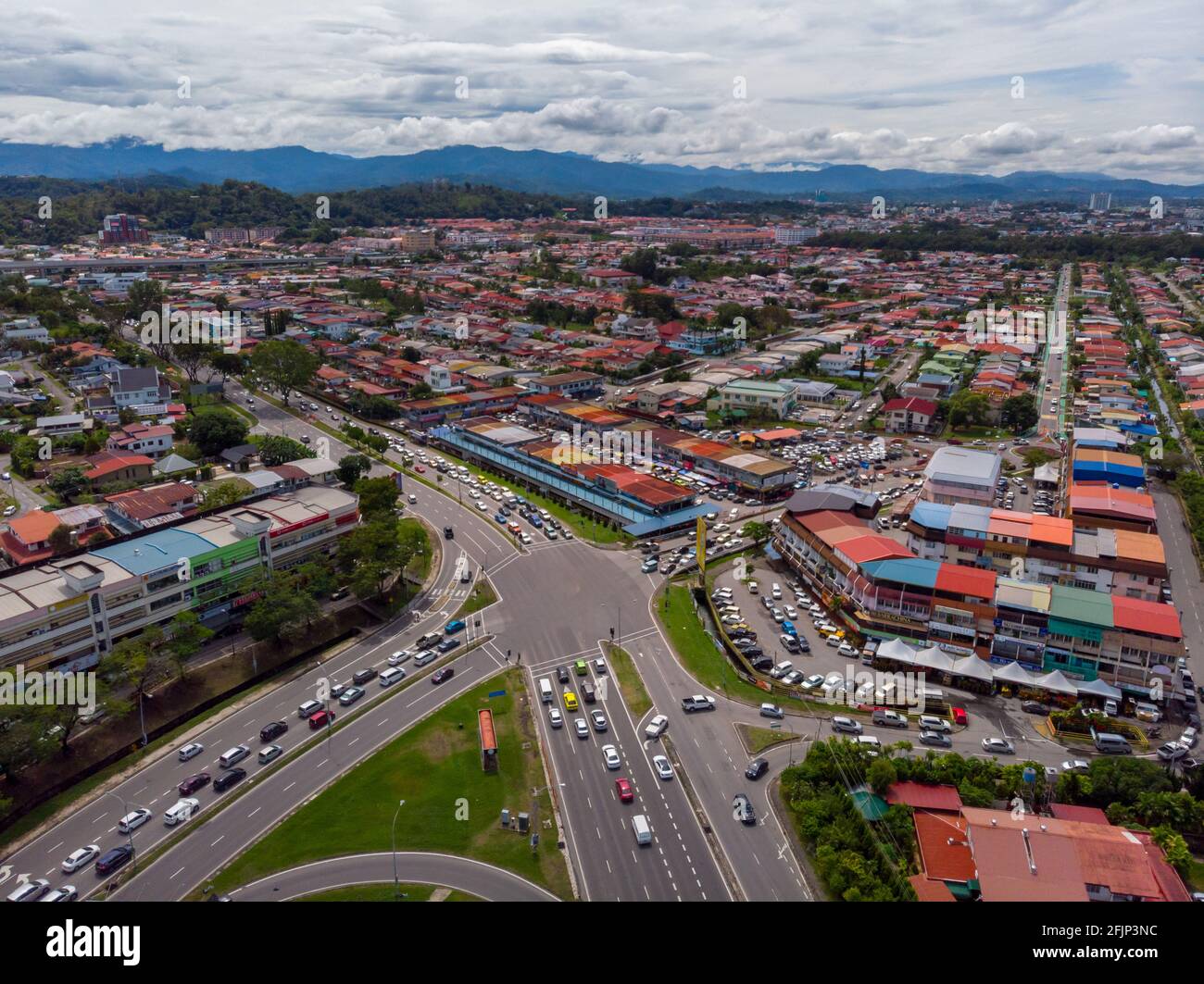 Aerial Drone image of car moving on surrounding Residential area at Kota Kinabalu, Sabah, Malaysia Stock Photo