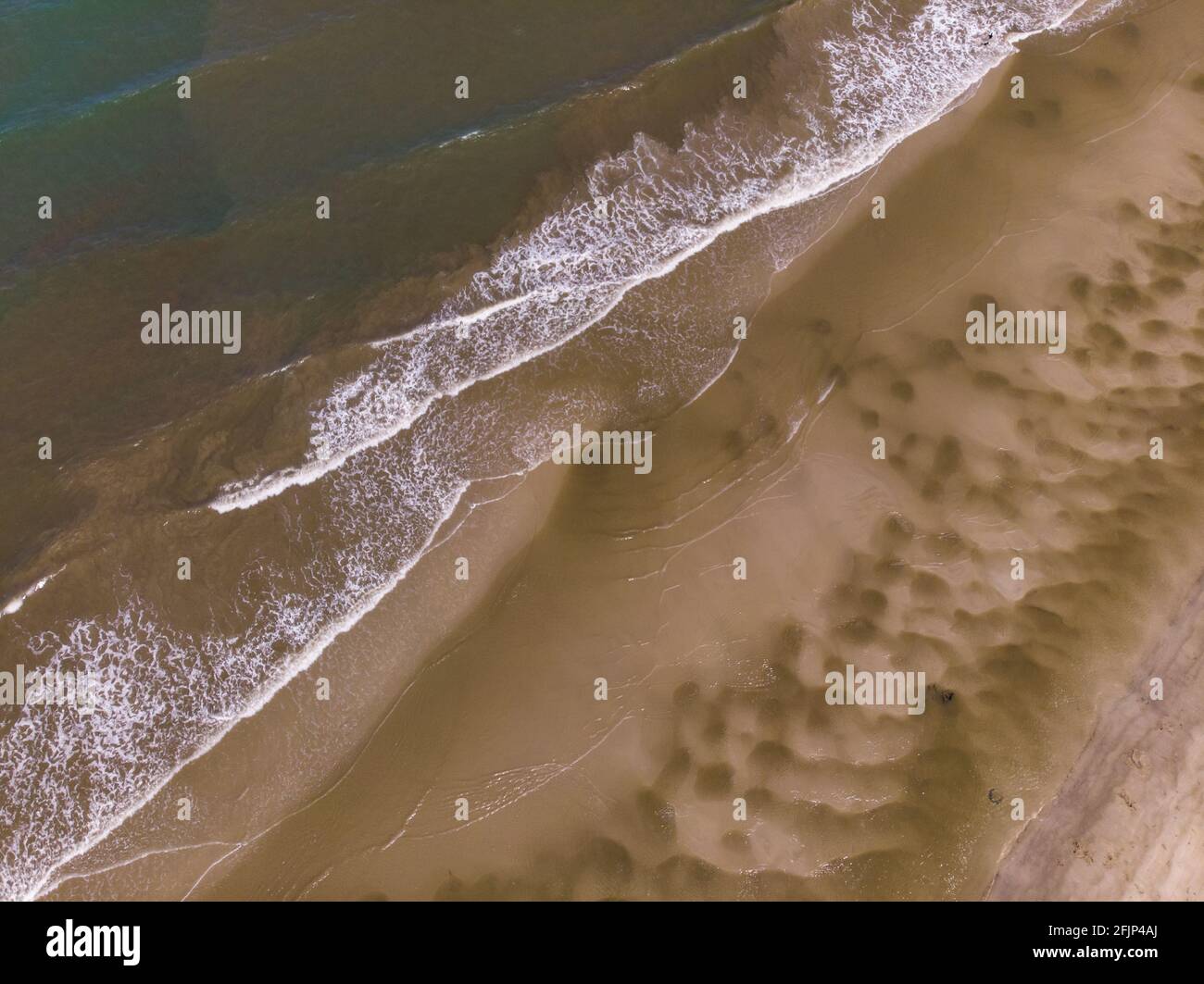 Aerial drone image view of ocean waves crashing on beach Stock Photo ...
