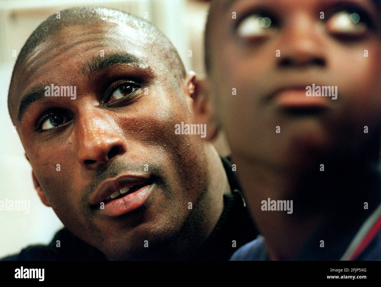 ENGLAND AND TOTTENHAM STAR SOL CAMPBELL  OCTOBER 2000 WITH NATHAN LAWRENCE (10) FROM THE SCOTT WILKEY PRIMARY SCHOOL IN LONDON TODAY TO CELEBRATE THE SUCCESS OF THE GOVERNMENTS PLAYING FOR SUCCESS PROGRAMME WHICH LINKS SPORTS AND SCHOOLS TO DEVELOP YOUNGSTERS INTEREST IN LEARNING Stock Photo