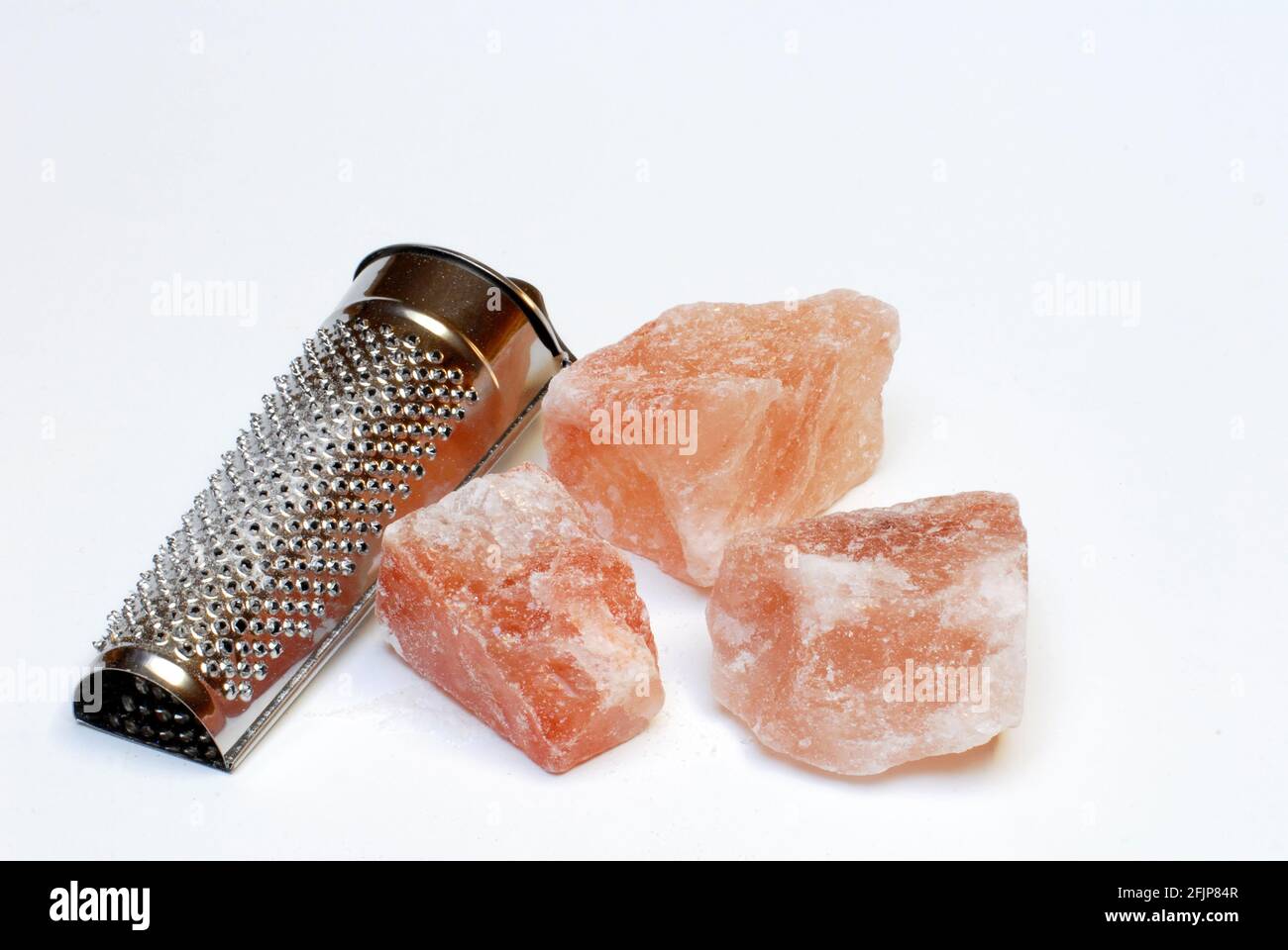 Himalayan salt with grater Stock Photo Alamy