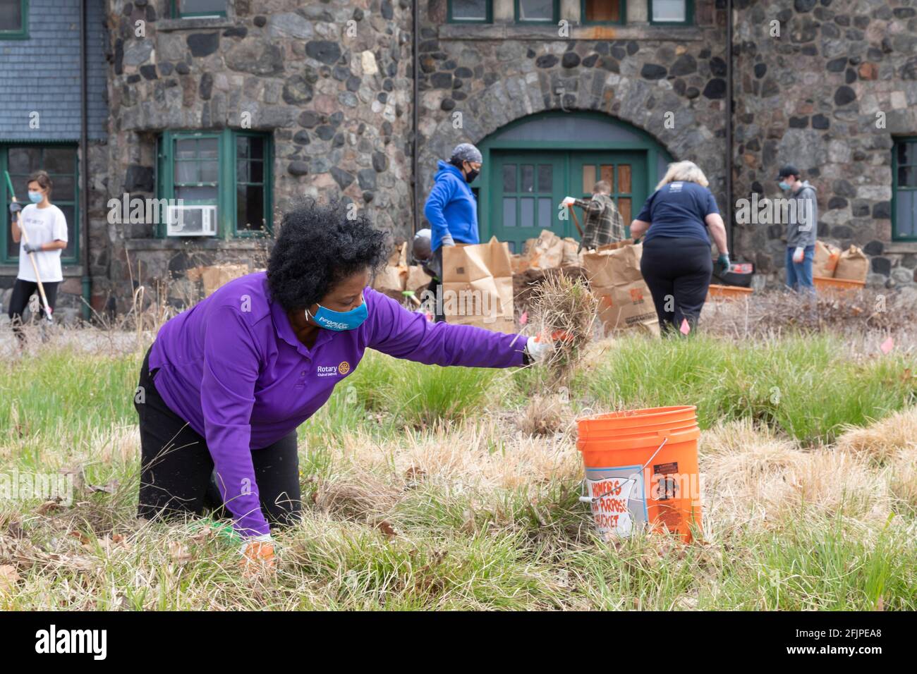 Detroit, Michigan - During Earth Week, volunteers clean up Rotary Park, a garden of native plants in Belle Isle State Park. The park is a project of m Stock Photo