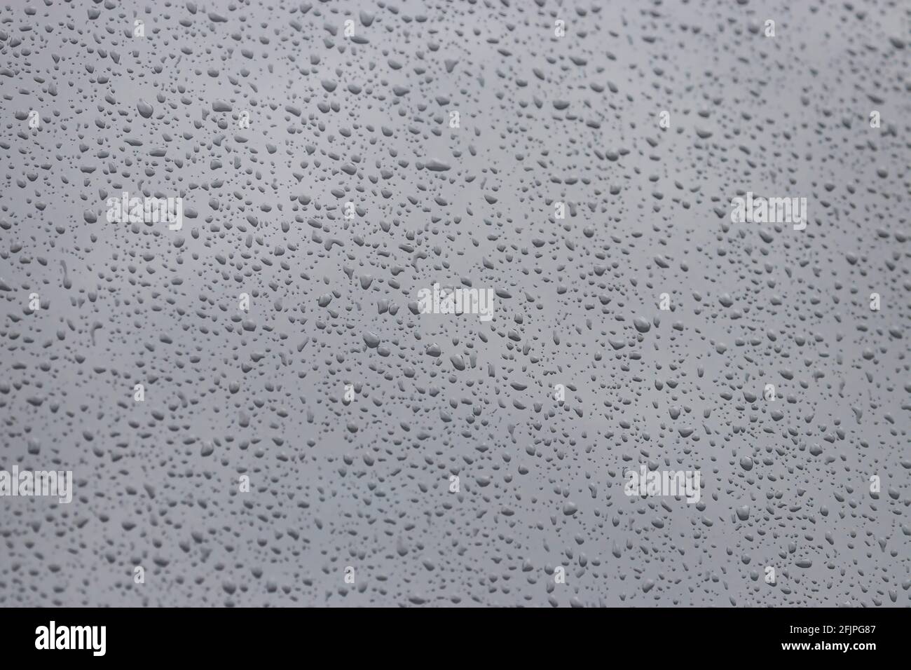 Stormy fall sky seen through window covered in drops Stock Photo - Alamy