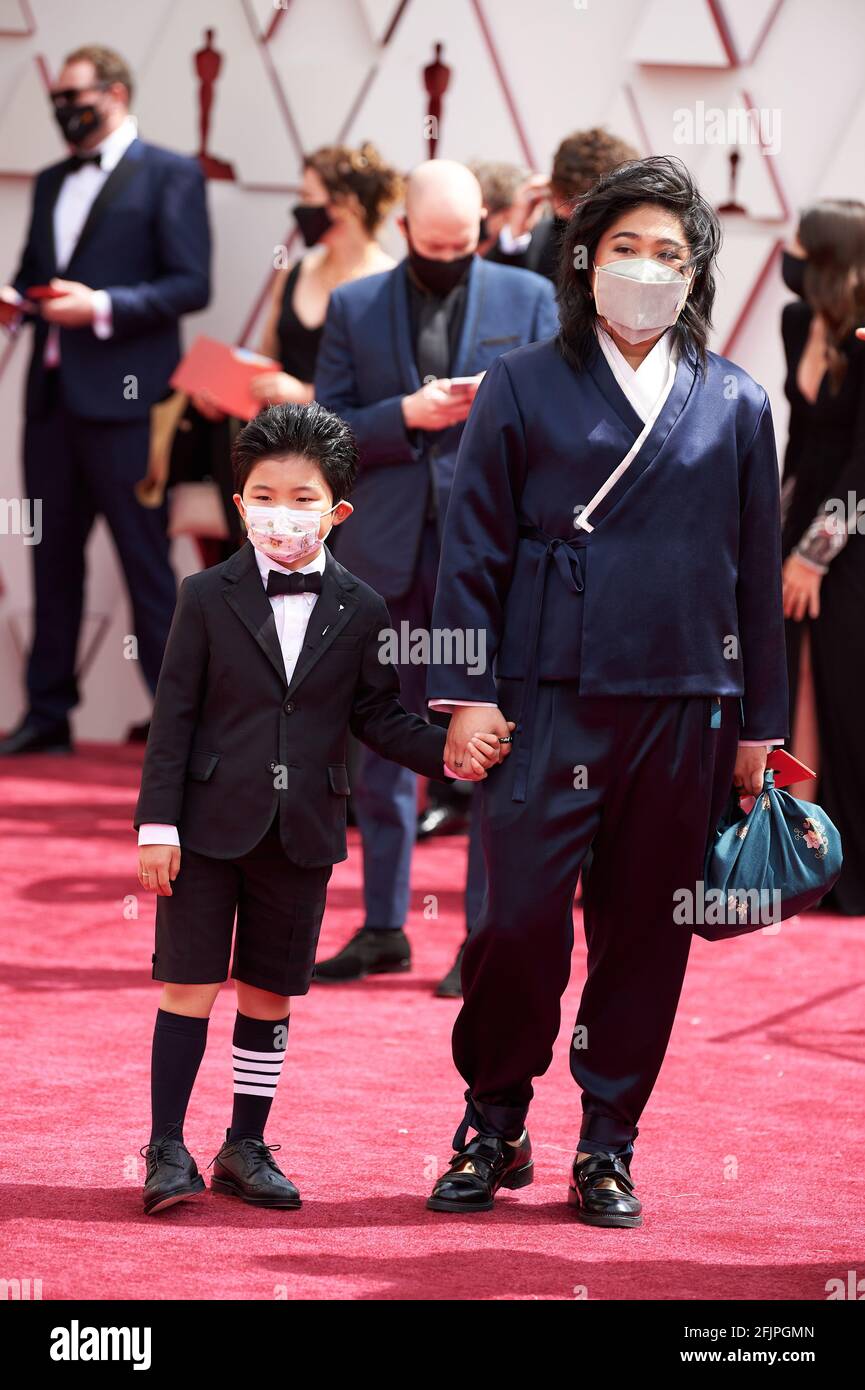 Los Angeles, USA. 25th Apr, 2021. Oscar® nominee Christina Oh arrives with Alan Kim on the red carpet of The 93rd Oscars® at Union Station in Los Angeles, CA on Sunday, April 25, 2021. (Photo courtesy Matt Petit/A.M.P.A.S. via Credit: Sipa USA/Alamy Live News Stock Photo