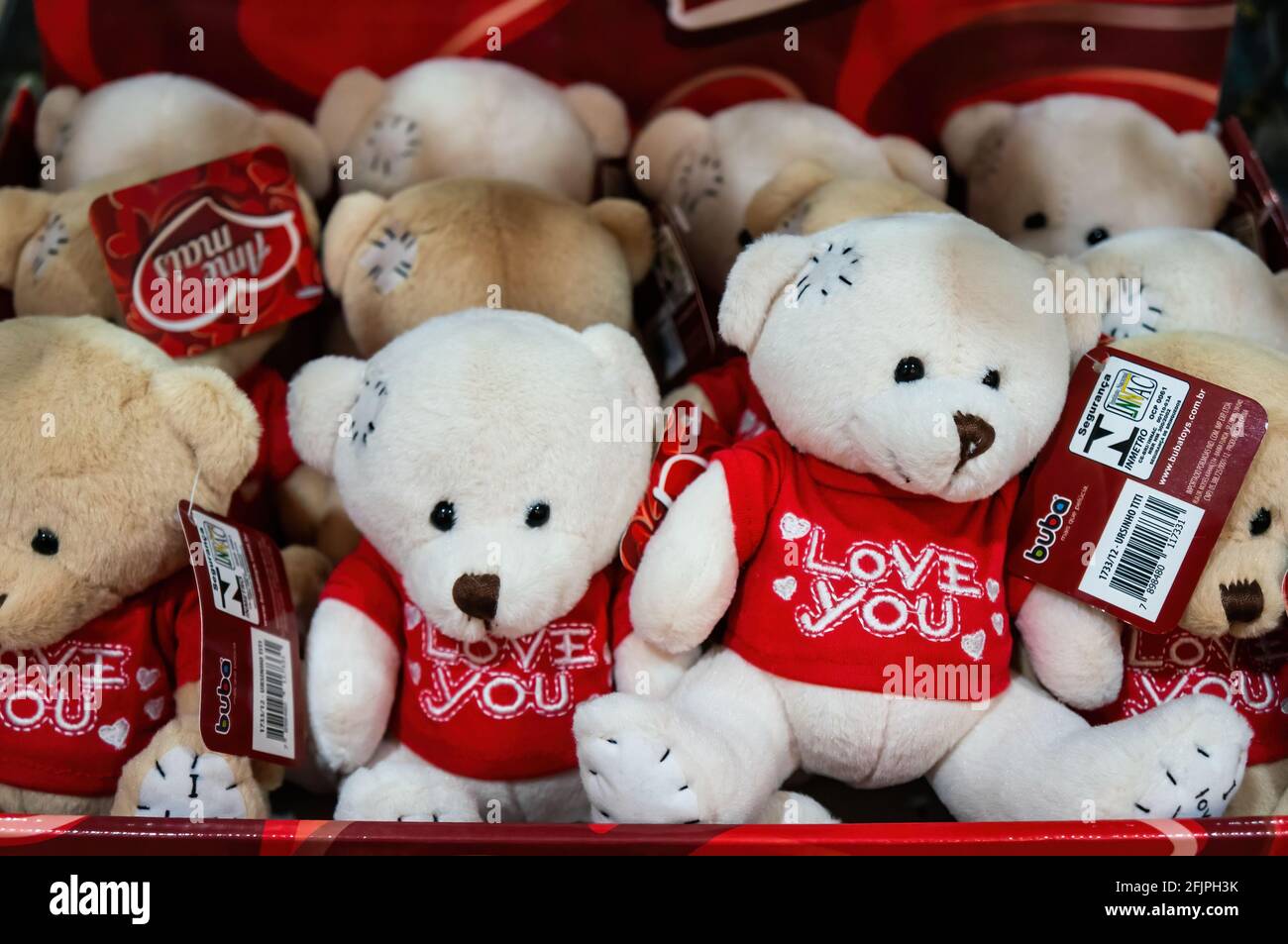 A shelf full of bear plushies wearing red shirts with 'Love You' message inside the gift and souvenir shop of Sao Paulo aquarium. Stock Photo