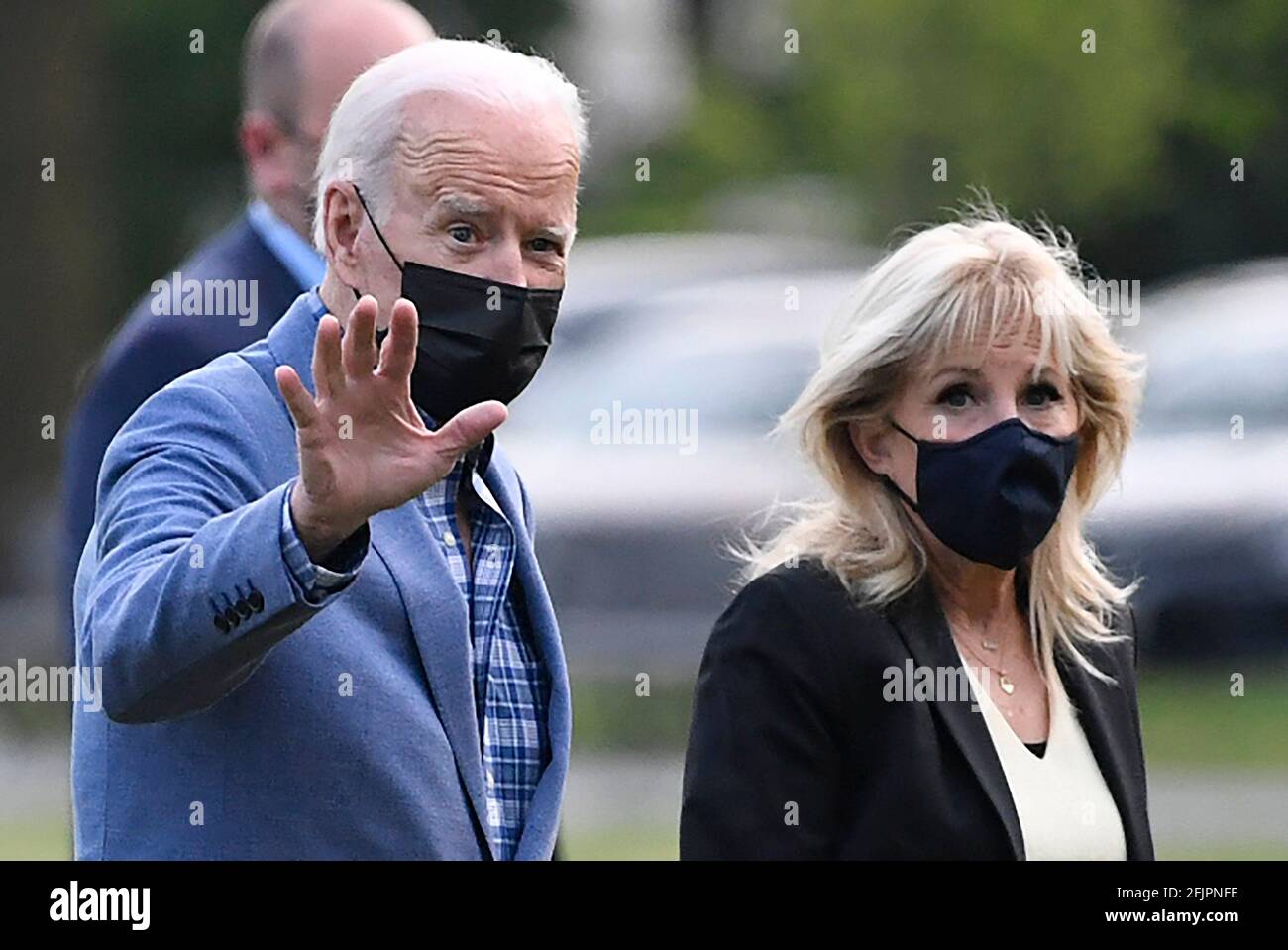 Washington, DC. 25th Apr, 2021. United States President Joe Biden waves to the press as he and first lady Dr. Jill Biden return to the White House, Sunday, April 25, 2021, in Washington, DC. The Bidens spent the weekend at their home in Wilmington, Delaware. Credit: Mike Theiler/Pool via CNP | usage worldwide Credit: dpa/Alamy Live News Stock Photo