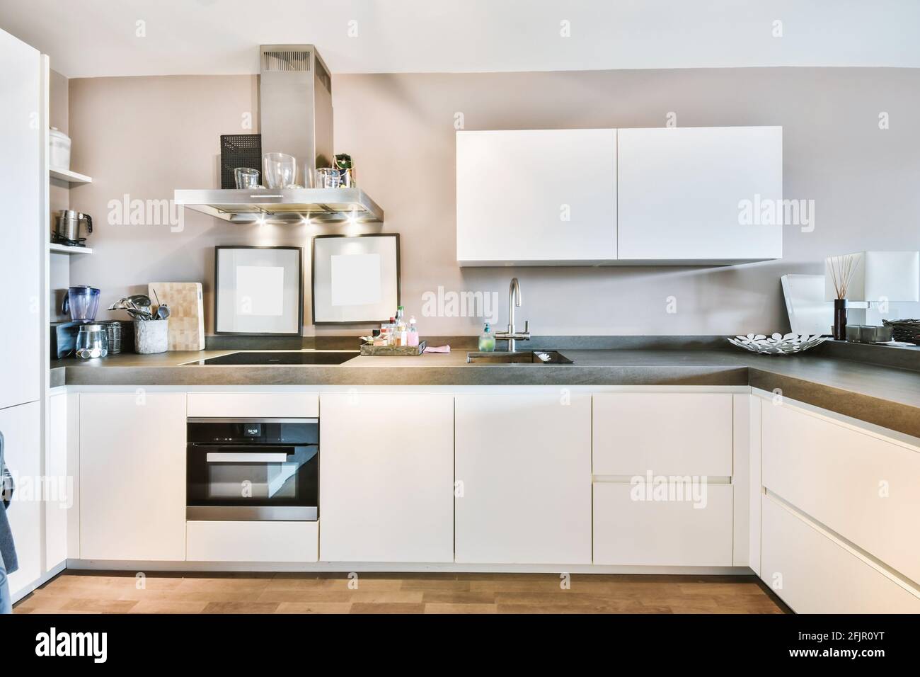Kitchen with minimalist style cupboards Stock Photo - Alamy