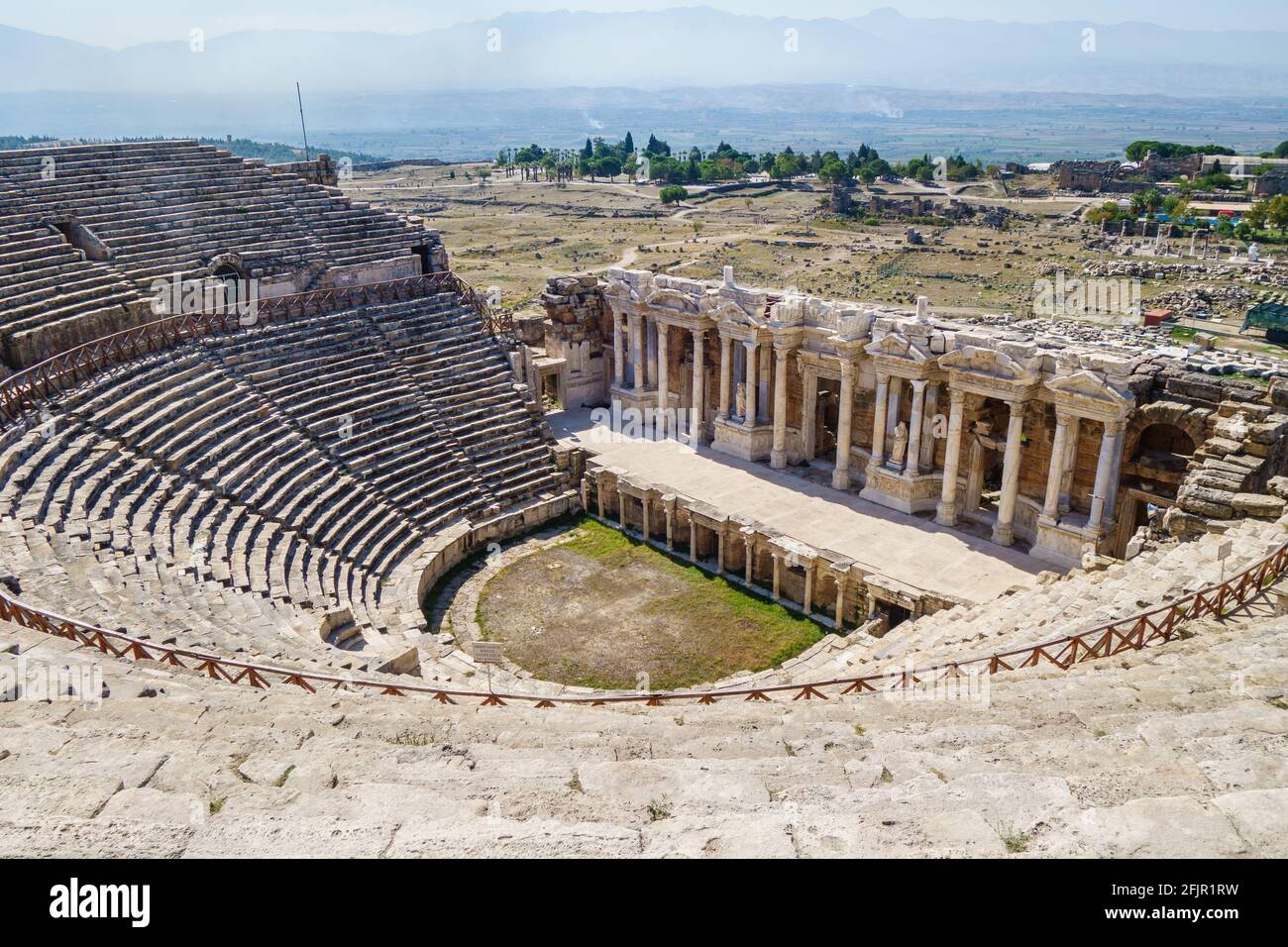 Antique theater in Hierapolis, ancient city near Pamukkale, Turkey. Scene  decorated in classic style with pillars, statues, portico Stock Photo -  Alamy