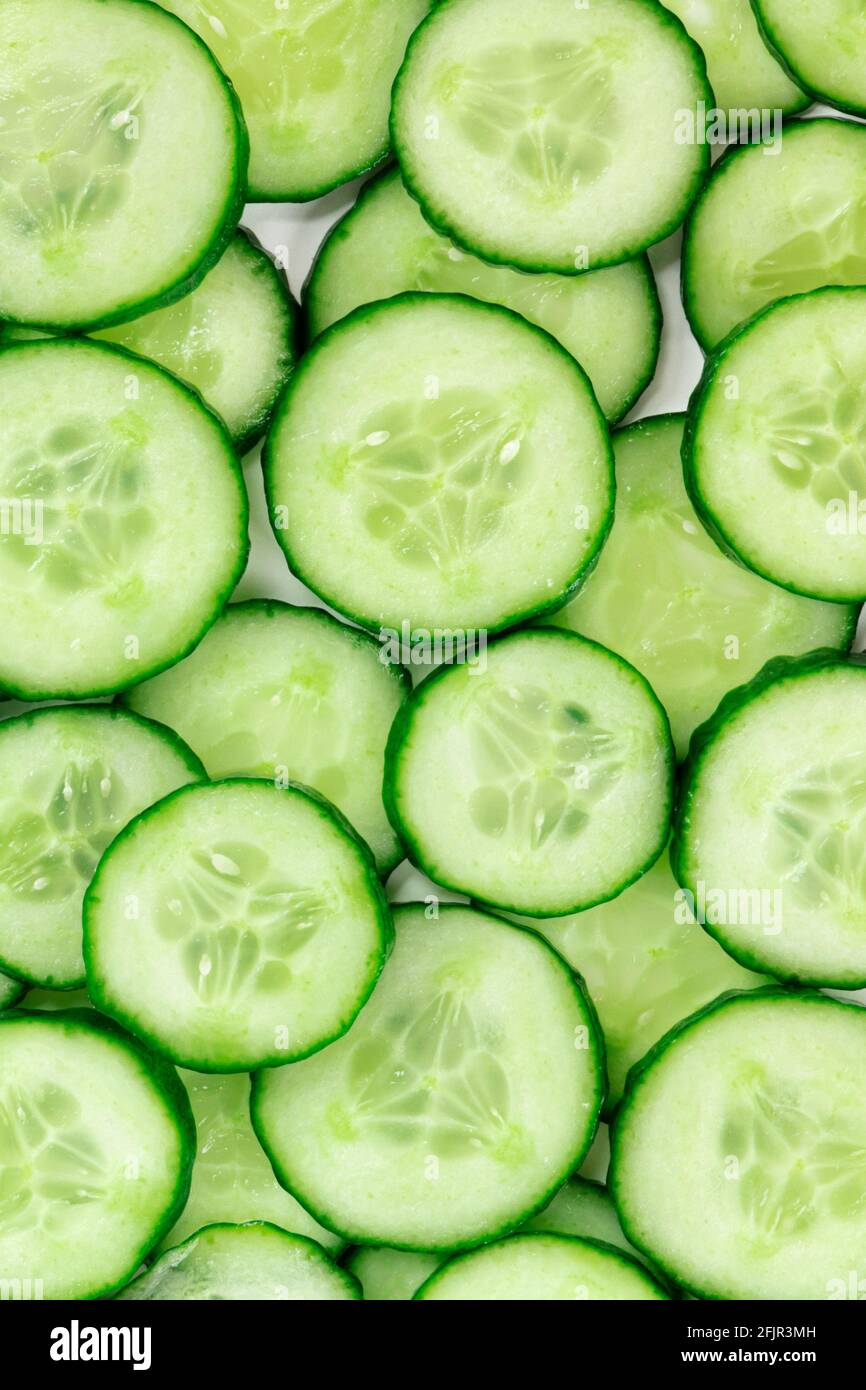 Cucumber slices texture, overhead flat lay shot Stock Photo