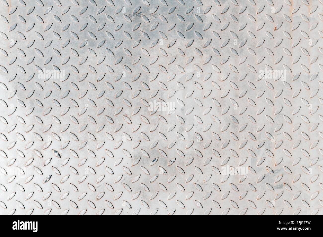 Non slip metal sheet plate surface texture as industrial background, checkered diamond embossed pattern, top view Stock Photo