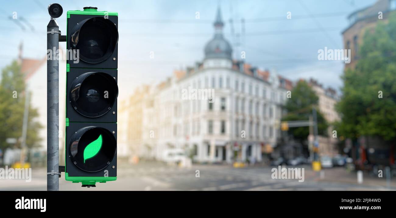 Traffic light with green leaf symbol. Clean mobility concept Stock Photo