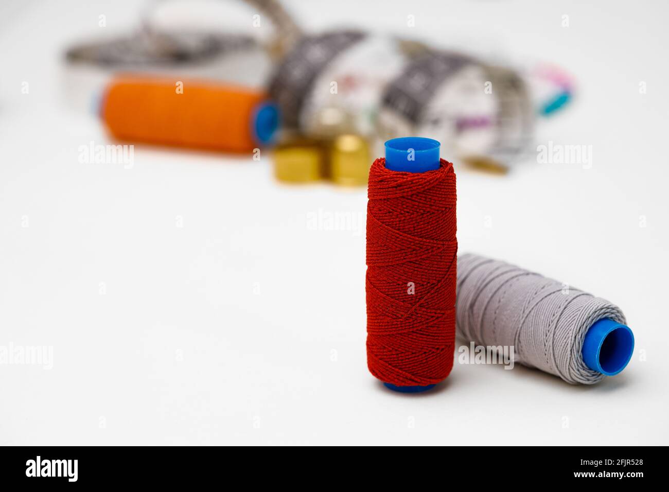Various sewing accessories isolated on white background Stock Photo - Alamy