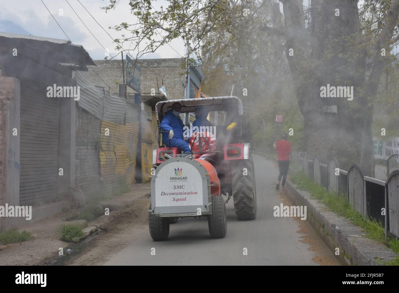Srinagar, Jammu and kashmir India 07 August 2020. Brave men covid heroes sanitizing srinagar city. Wearing kits and taking safty measures are in sop d Stock Photo
