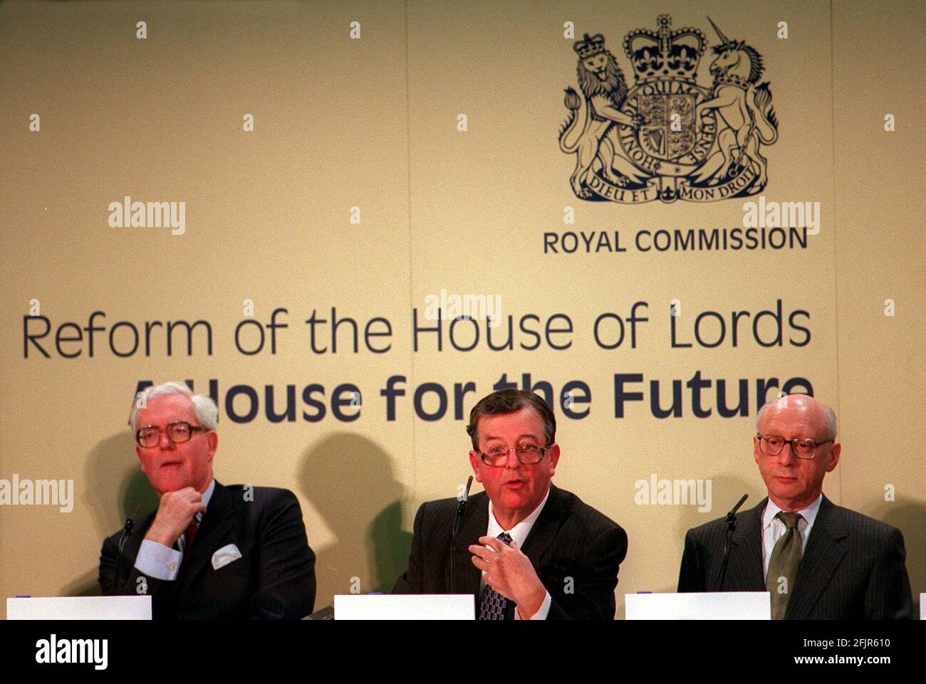 Lord Wakeham January 2000 CENTRE Chairman of the Royal Commission into reform of the upper house - The House Of Lords - speaking at news press conference presenting report at Church House - Pictured with LEFT Lord Hurd and RIGHT Gerald Kaufman Stock Photo