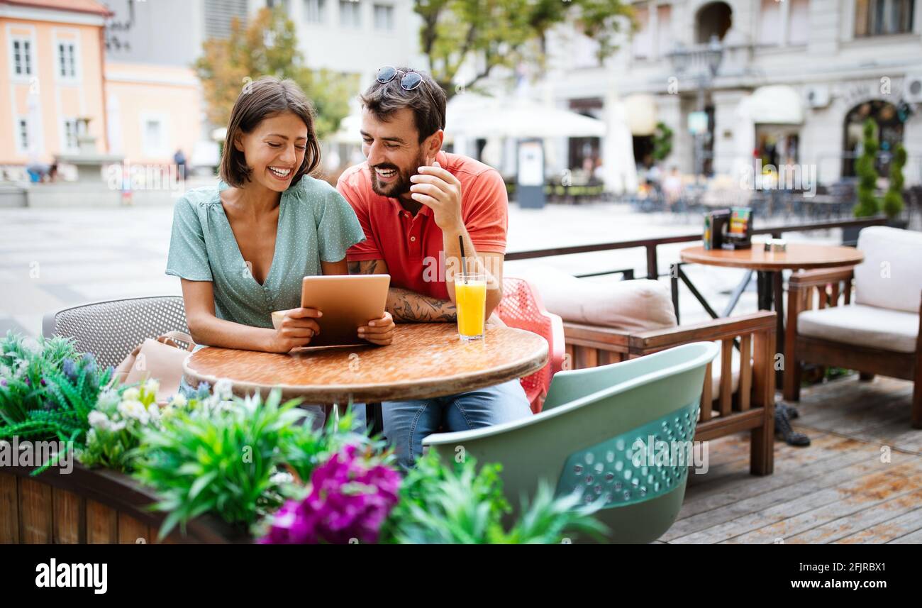 Happy couple drinking coffee in outdoors cafe on summer vacation Stock ...