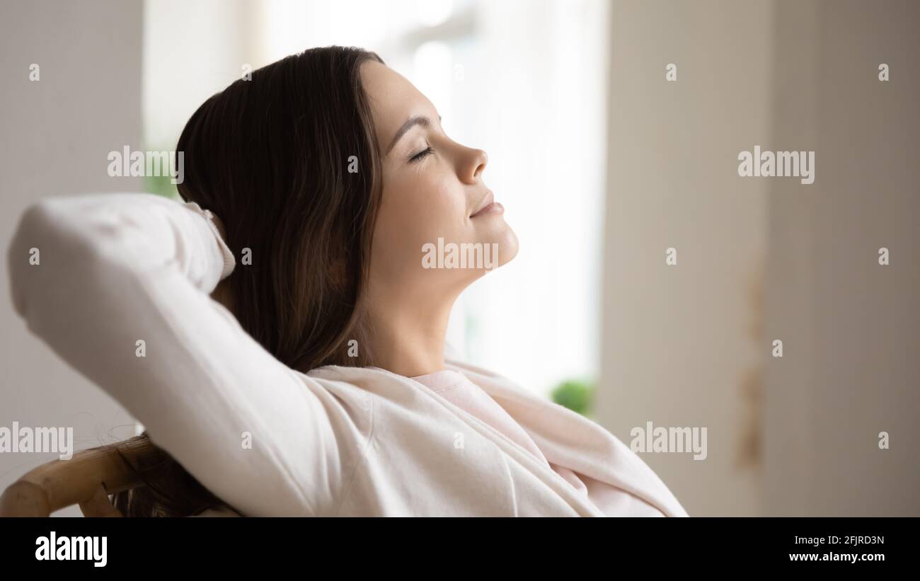 Relaxed peaceful young woman with closed eyes breathing fresh air Stock ...