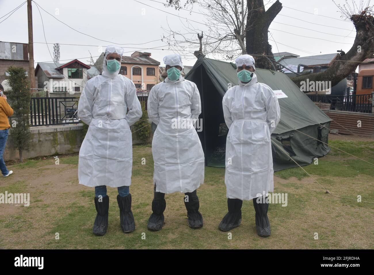 Srinagar, Jammu and kashmir India 07 August 2020. White Kit wearing frontline men warriors are in a single line and ready to fight against coronavirus Stock Photo