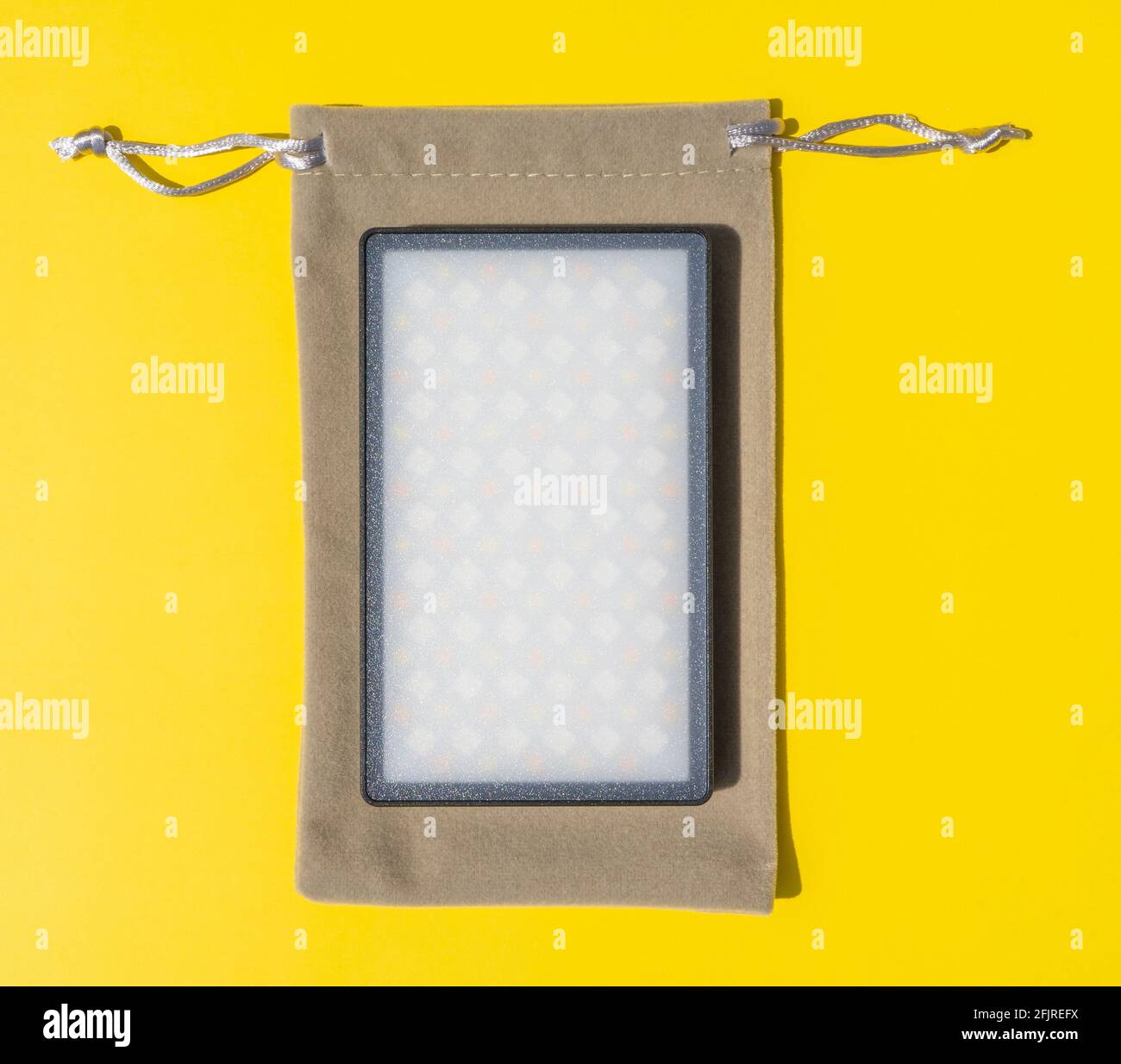 Led screen portable macro texture isolated on yellow background. Art
