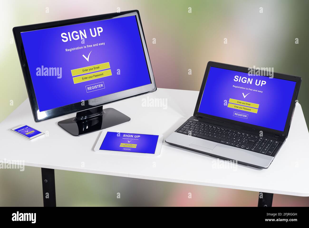 Sign up concept shown on different information technology devices Stock ...
