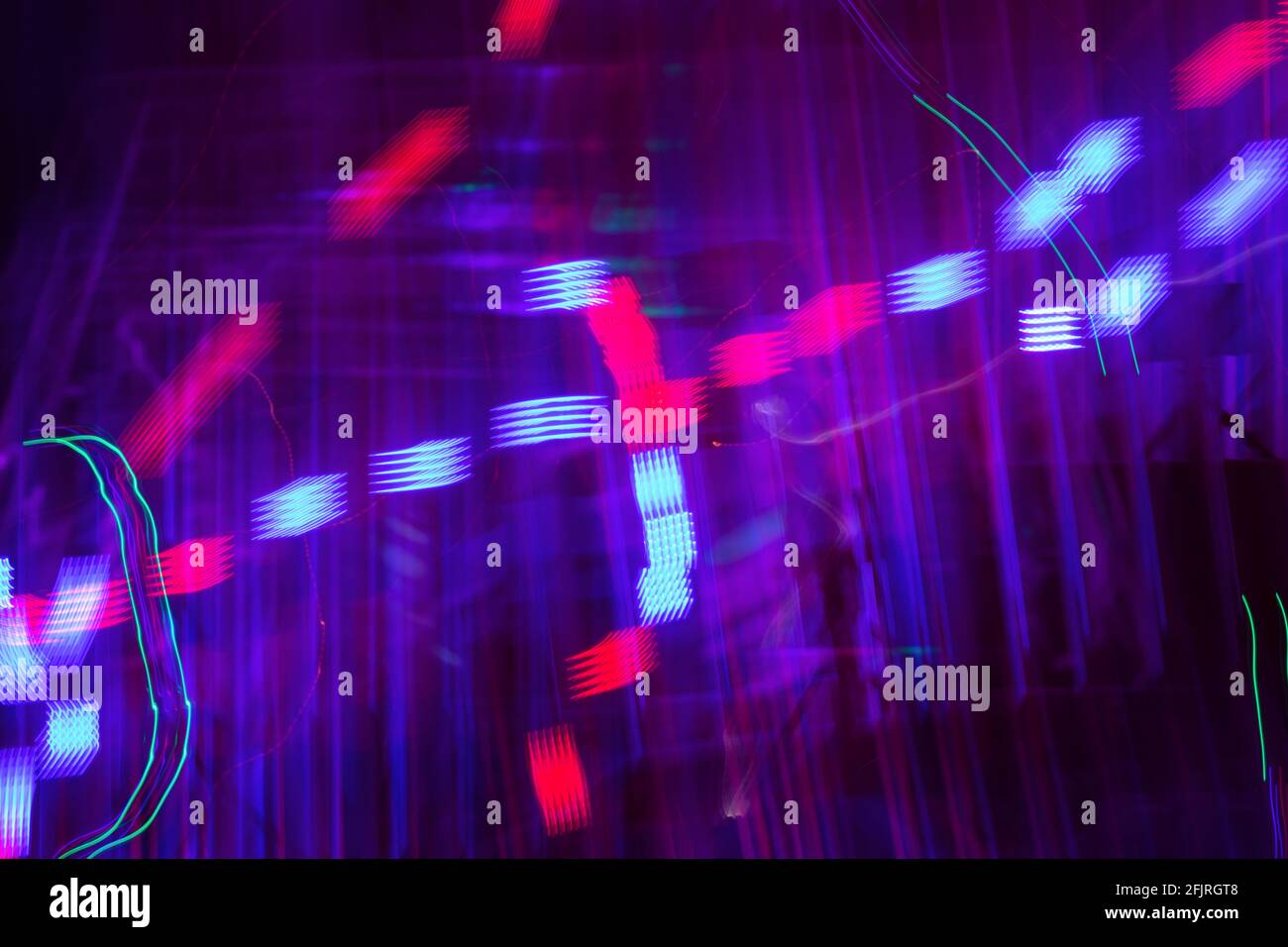 Long exposure photo of colorful moving lights creating beautiful abstract patterns. Stock Photo