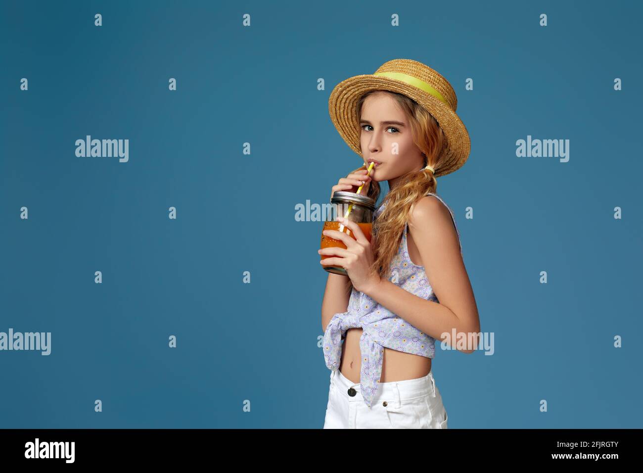 Portrait of cute little child girl drinking orange juice Stock Photo ...