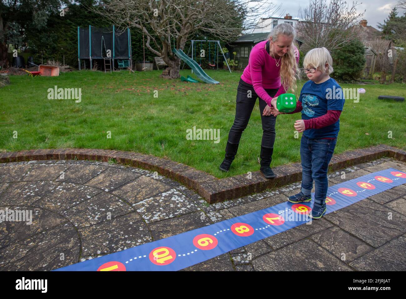 Karen McGuigan, the Maths Mum rewriting the curriculum for kids who learn differently at home with her son Lance, England, United Kingdom Stock Photo