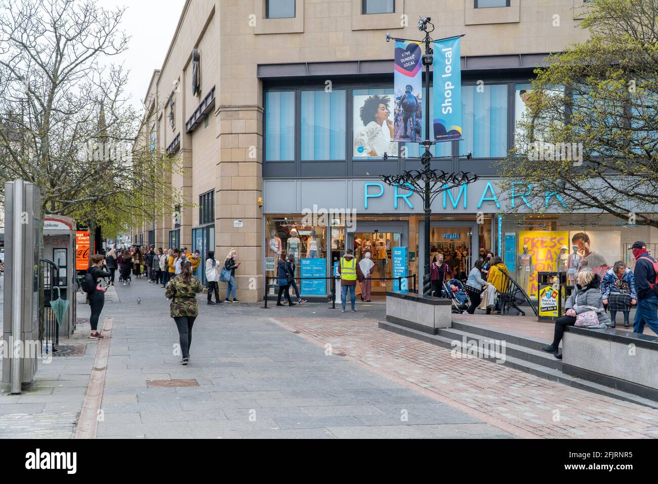 Dundee, Tayside, Scotland 26.04.21: Large queue of people waiting to go shopping in primark, at the overgate shopping centre, Dundee, on the day Scotland moves to stage 3 lockdown, after months of a second lockdown, which seen all shops closed. Credit: Barry Nixon Stable Air Media/Alamy Live News Stock Photo