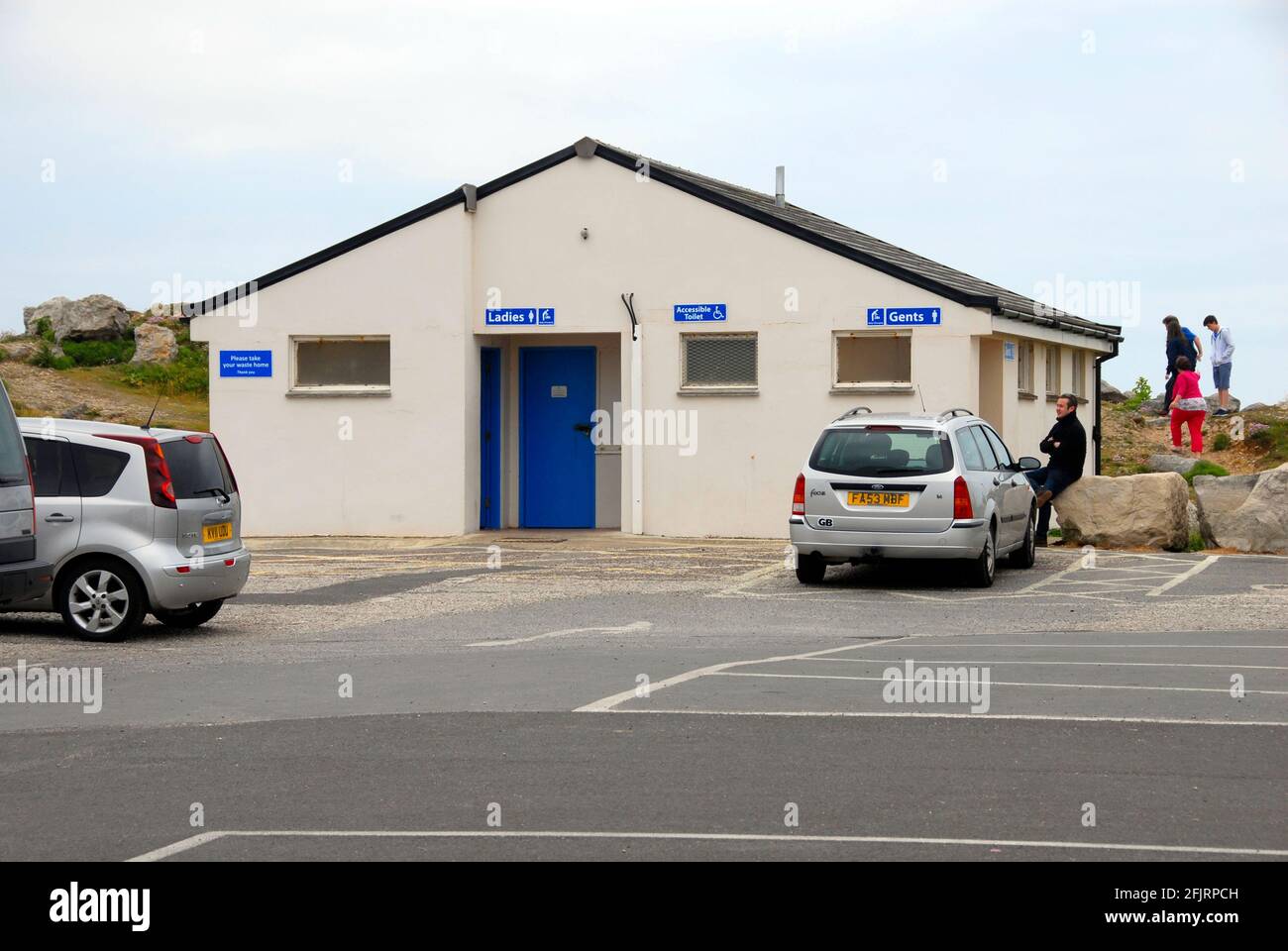 Modern public toilet in car park at holiday location Stock Photo